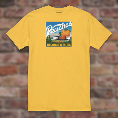 Peaches Records & Tapes Daisy T-shirt flat lay on brick background
