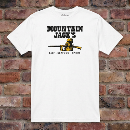 Mountain Jack's White T-shirt flat lay on brick background
