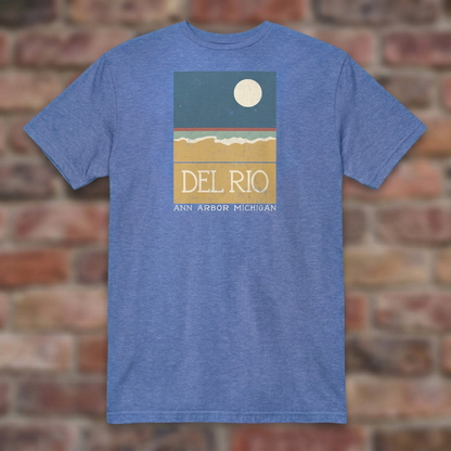 Del Rio Ann Arbor Heather Royal T-shirt flat lay on brick background