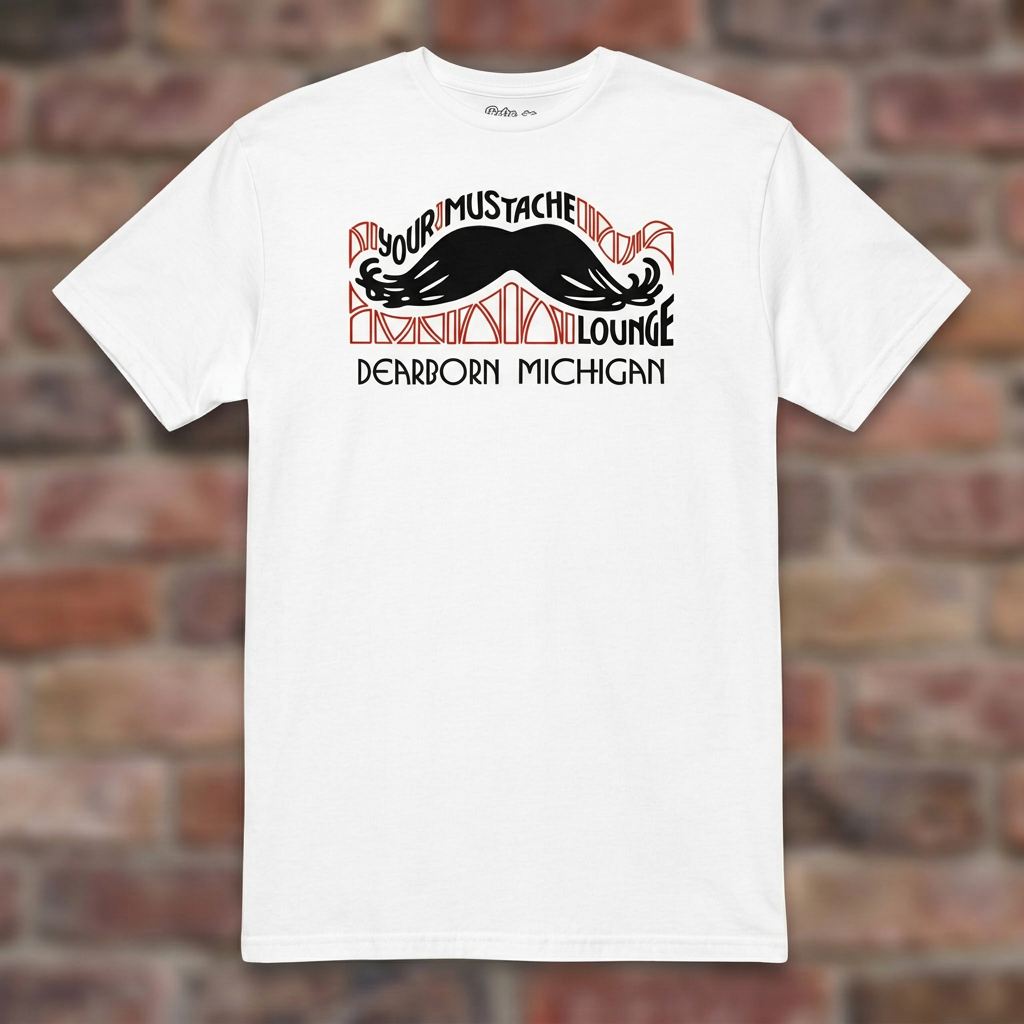 Your Mustache Lounge Dearborn White T-shirt flat lay on brick background