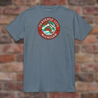 Traverse City Michigan Heather Indigo T-shirt flat lay on brick background