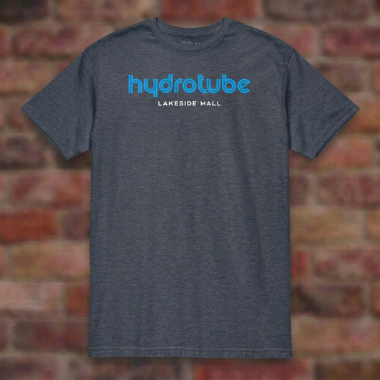 Hydrotube Heather Navy T-shirt flat lay on brick background