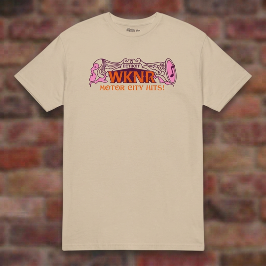 WKNR Radio Sand T-shirt flat lay on brick background
