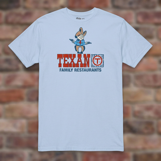 Light Blue Texan Family Restaurant T-shirt flat lay on warm brick