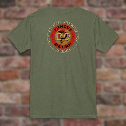Pfeiffer Brewing Co. Detroit Military Green T-shirt flat lay on brick background