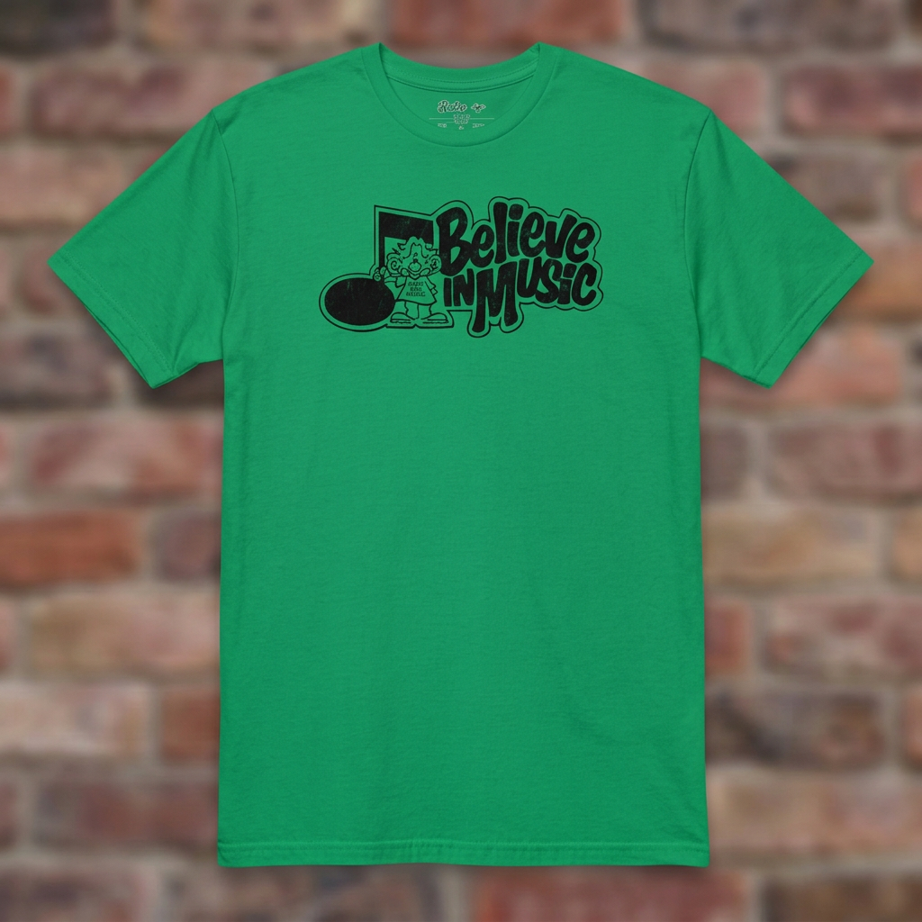 Irish Green Believe in Music T-shirt flat-lay on weathered brick