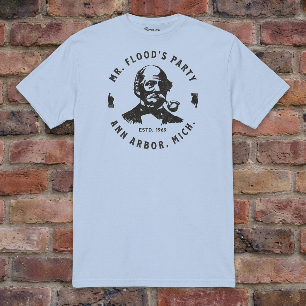 Mr. Flood's Party Light Blue T-shirt flat lay on warm brick