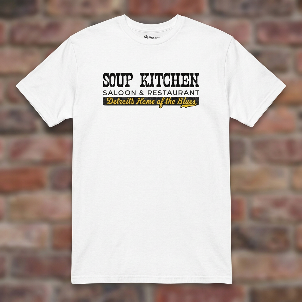Soup Kitchen Saloon White T-shirt flat lay on brick background