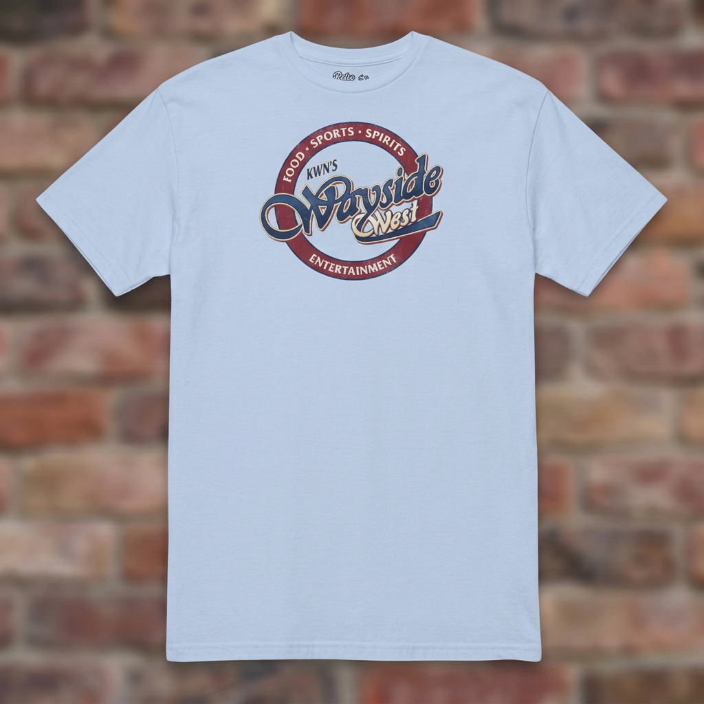 Wayside West Light Blue T-shirt flat lay on brick background