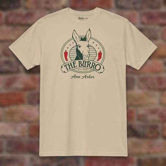 The Burro Ann Arbor Sand T-shirt flat lay on brick background