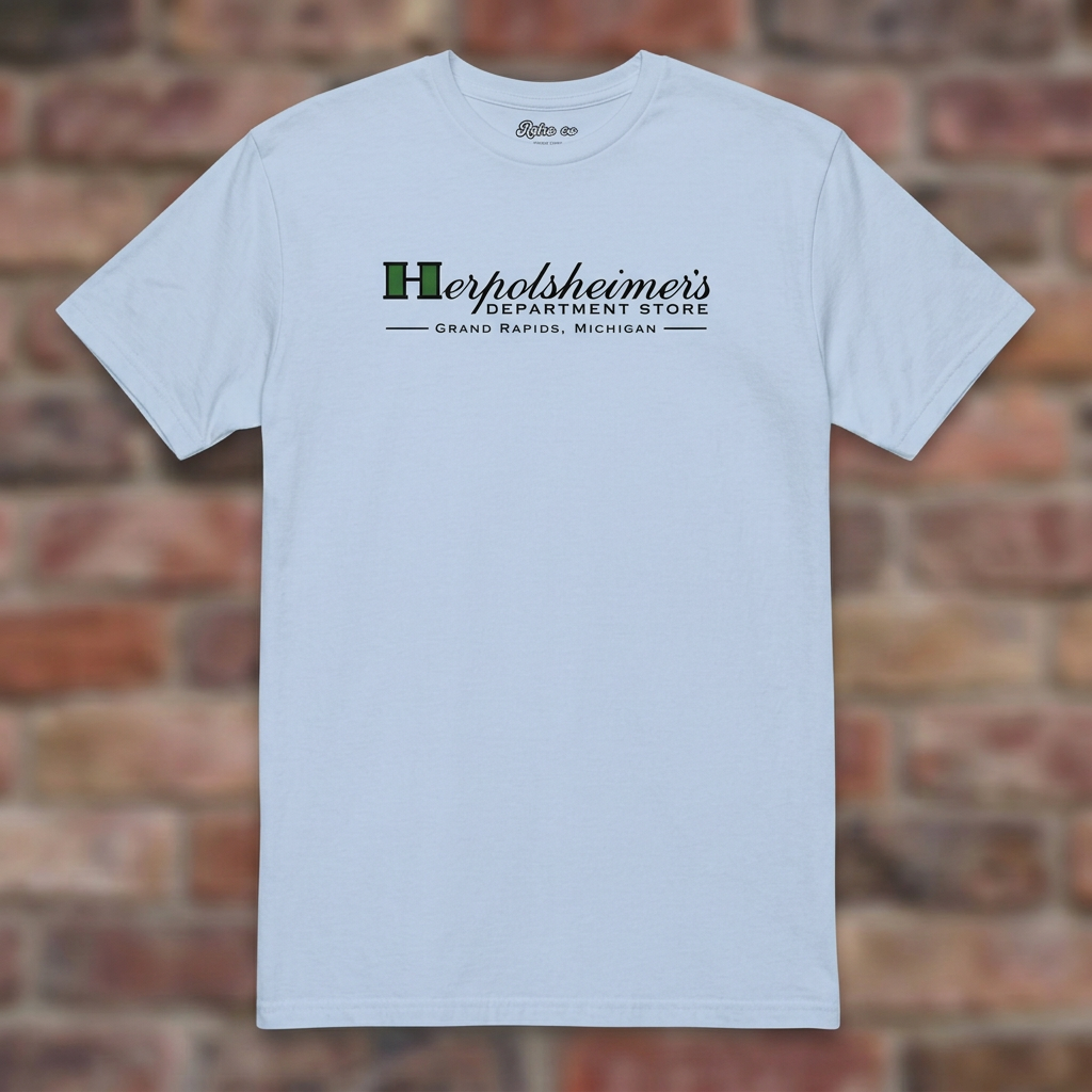 Herpolsheimer's Light Blue T-shirt flat lay on brick background