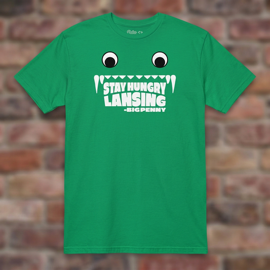 Big Penny Stay Hungry Lansing Irish Green T-shirt flat lay on brick background