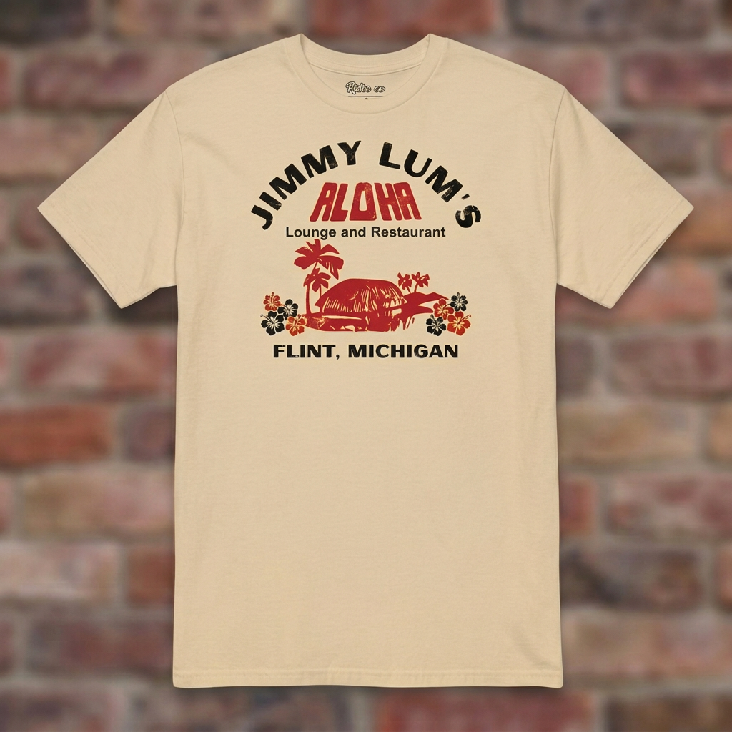 Jimmy Lum's Sand T-shirt flat lay on brick background