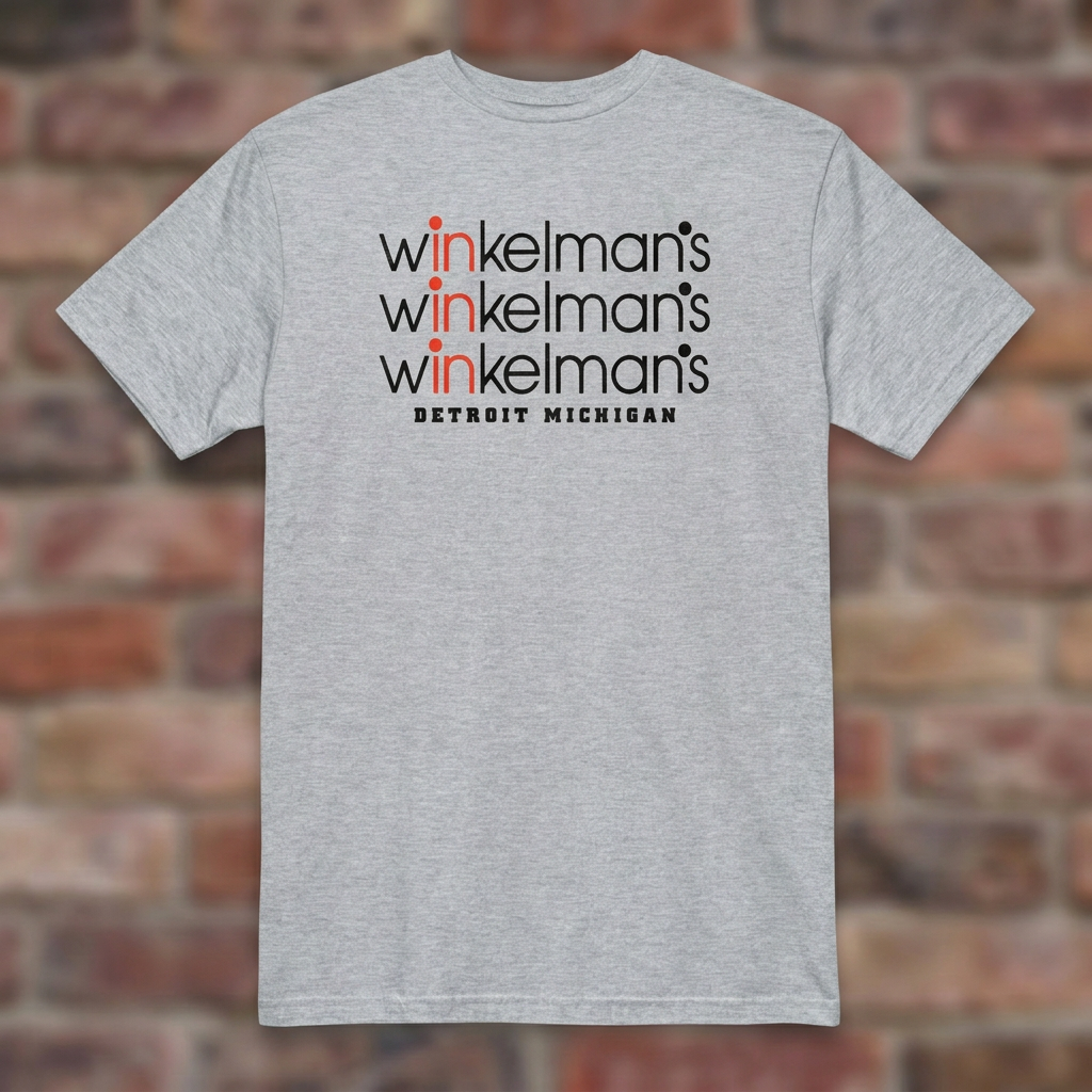 Winkelman's Sport Grey T-shirt flat lay on brick background