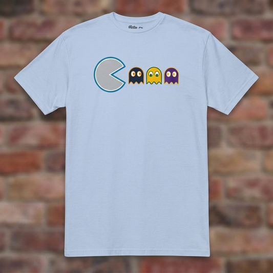 Detroit Pac Man Rivals Light Blue T-shirt flat lay on brick background