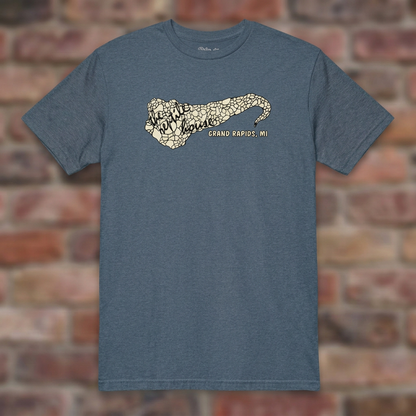The Reptile House Grand Rapids Heather Indigo T-shirt flat lay on brick background