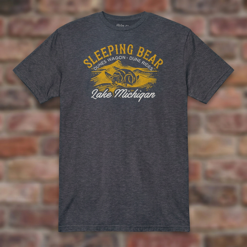 Sleeping Bear Dune Rides Heather Navy T-shirt flat lay on brick background