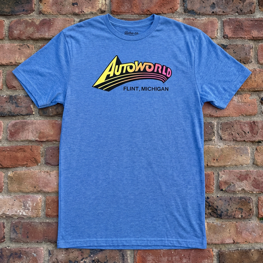 Autoworld Heather Royal T-shirt flat lay on brick background