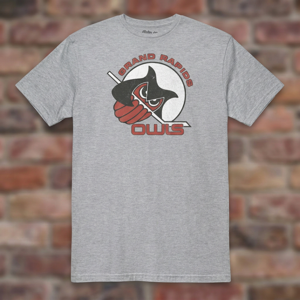 Grand Rapids Owls Hockey Sport Grey T-shirt flat lay on brick background