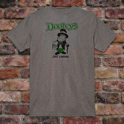 Graphite Heather Dooley's East Lansing T-shirt flat-lay against weathered brick