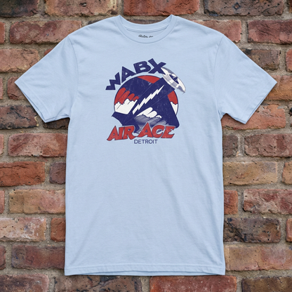 WABX Air Ace Light Blue T-shirt flat lay on brick background