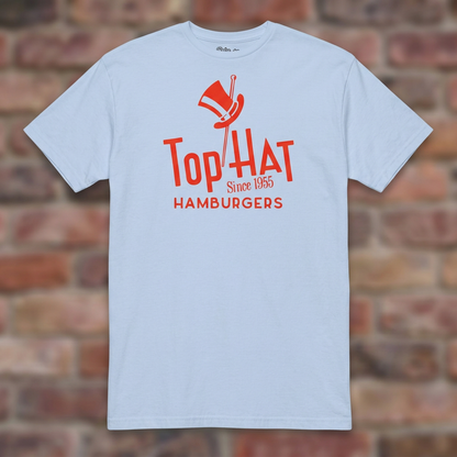 Top Hat Hamburgers Light Blue T-shirt flat lay on brick background