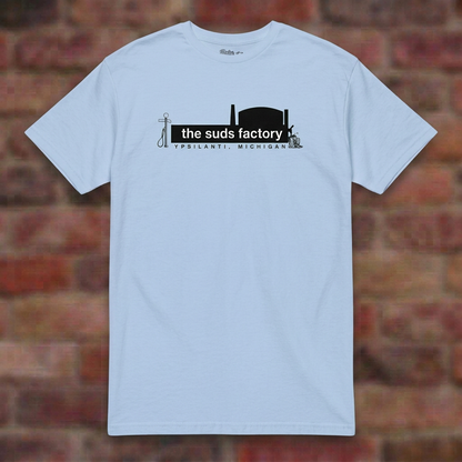 The Suds Factory Light Blue T-shirt flat lay on brick background