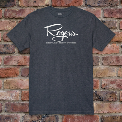 Roger's Department Store T-shirt in Heather Navy, flat lay on warm brick background