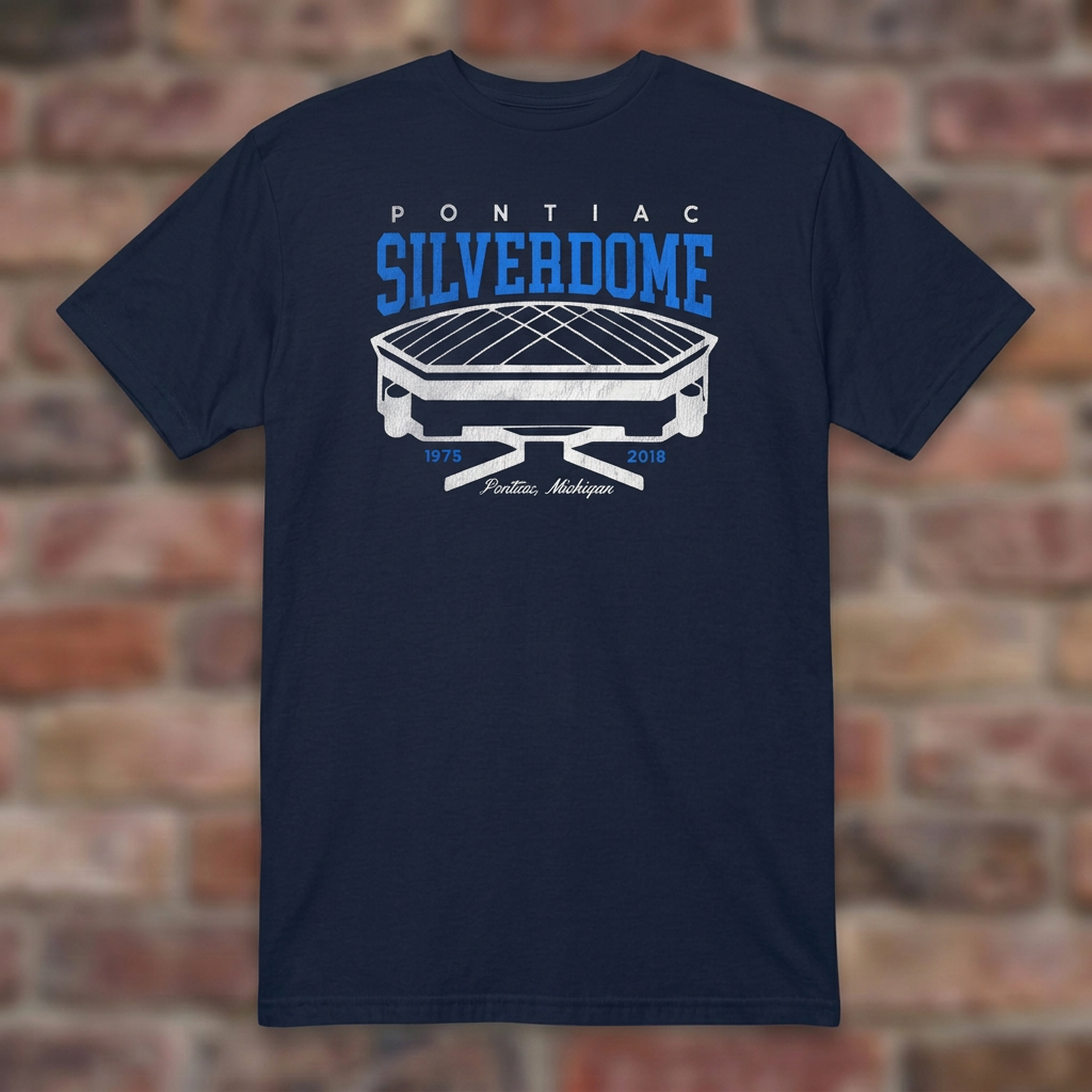 Pontiac Silverdome Navy T-shirt flat lay on brick background