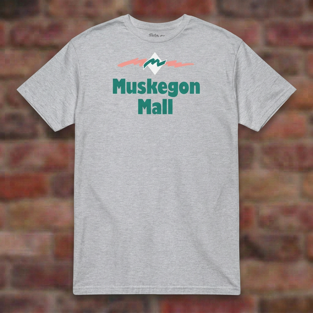 Muskegon Mall Sport Grey T-shirt flat lay on brick background