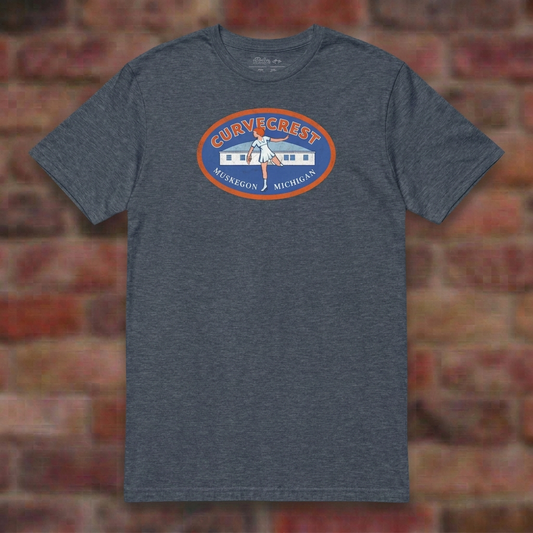 Curvecrest Roller Rink Heather Navy T-shirt flat lay on brick background