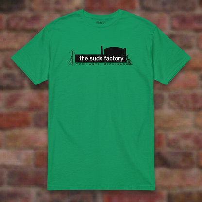 The Suds Factory Irish Green T-shirt flat lay on brick background