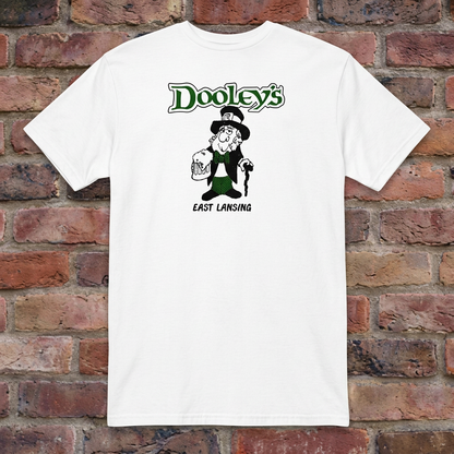 White Dooley's East Lansing T-shirt flat-lay against weathered brick