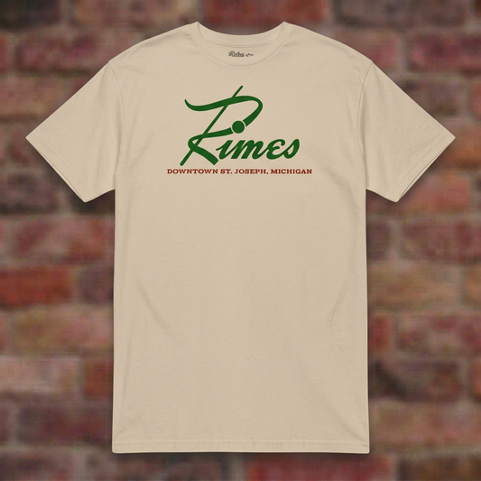 Rimes Sand T-shirt flat lay on brick background