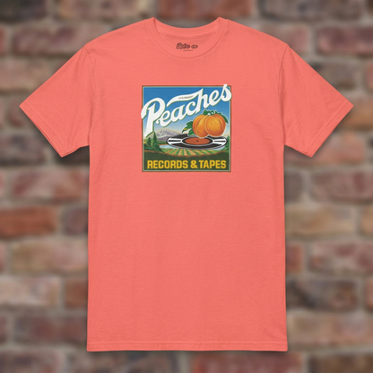 Peaches Records & Tapes Coral Silk T-shirt flat lay on brick background