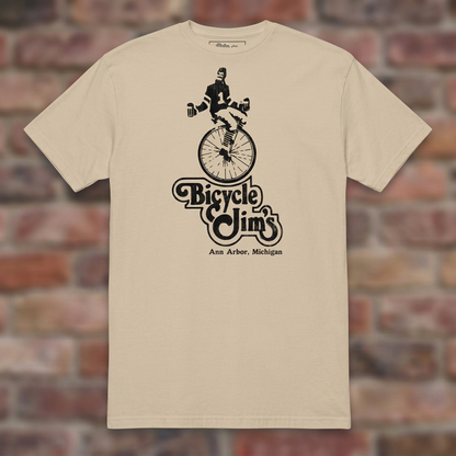 Bicycle Jim's Sand T-shirt flat lay on brick background