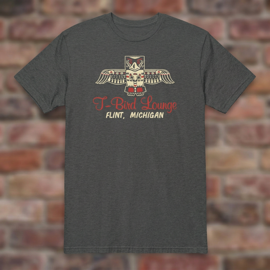 T-Bird Lounge Dark Heather Grey T-shirt flat lay on brick background