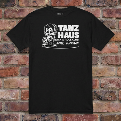 Tanz Haus Black T-shirt flat lay on warm brick