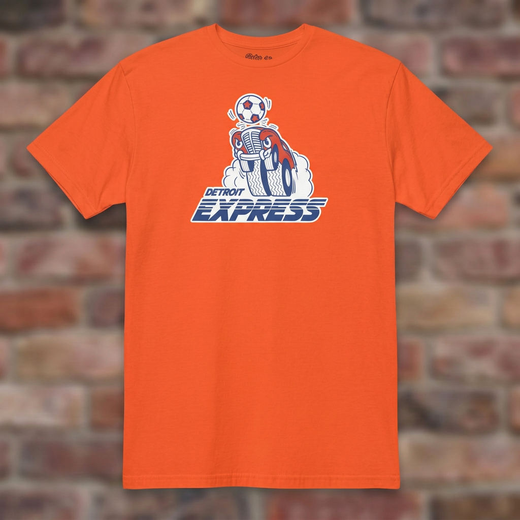 Detroit Express Soccer Orange T-shirt flat lay on brick background