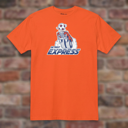 Detroit Express Soccer Orange T-shirt flat lay on brick background