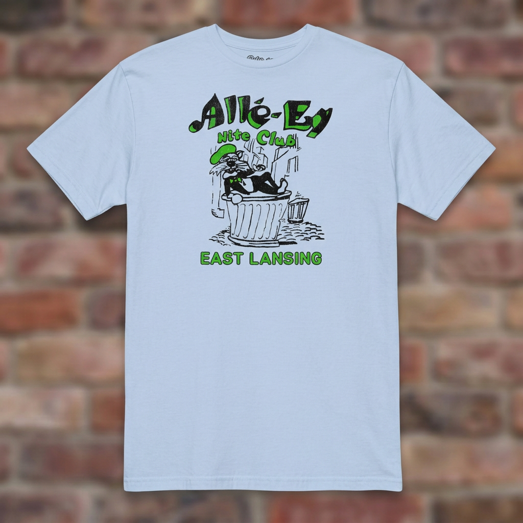 Alle-Ey Nite Club Light Blue T-shirt flat lay on brick background