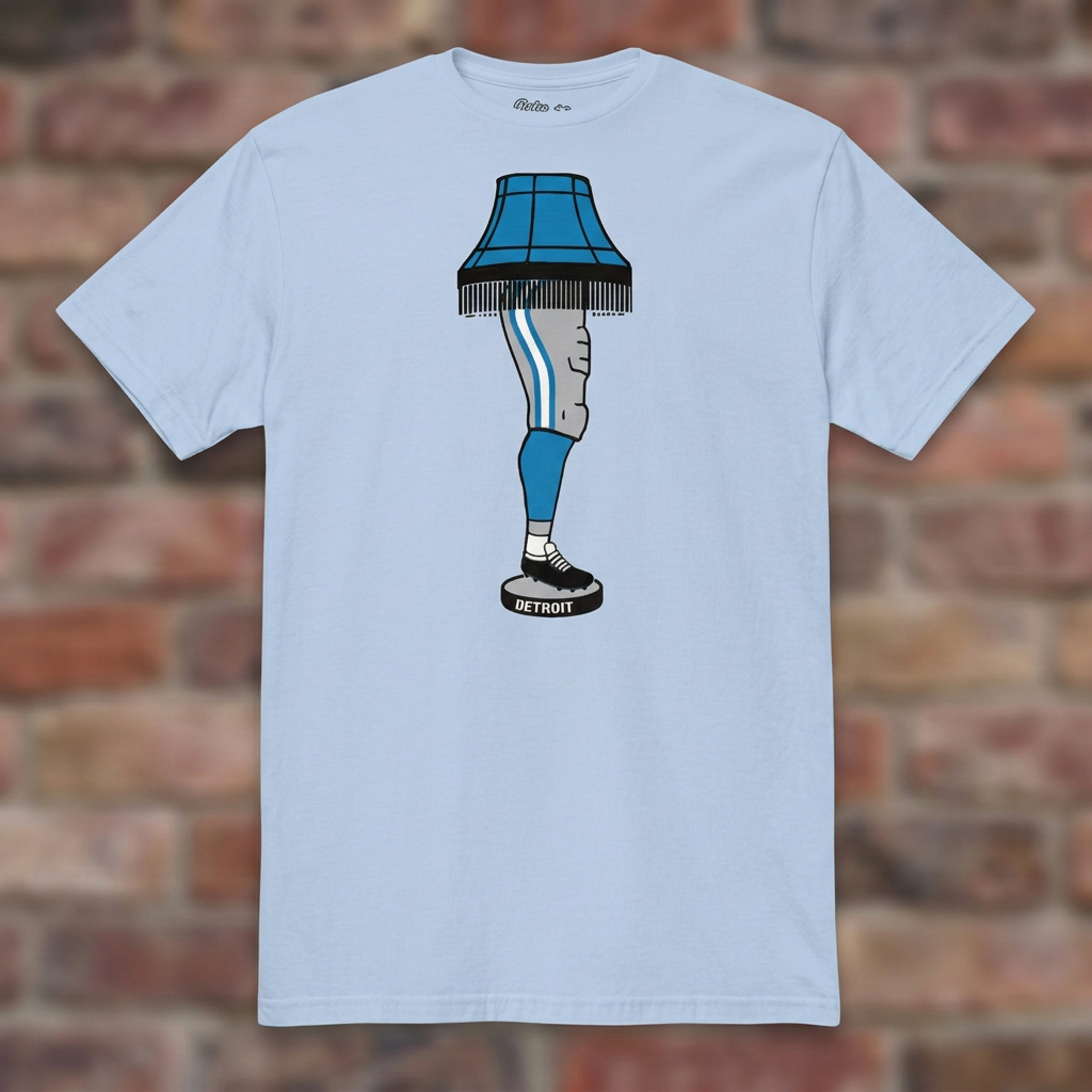 Light Blue Detroit Football Leg Lamp T-shirt flat-lay against weathered brick