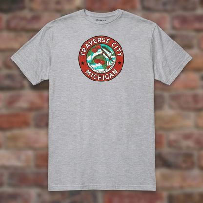 Traverse City Michigan Sport Grey T-shirt flat lay on brick background