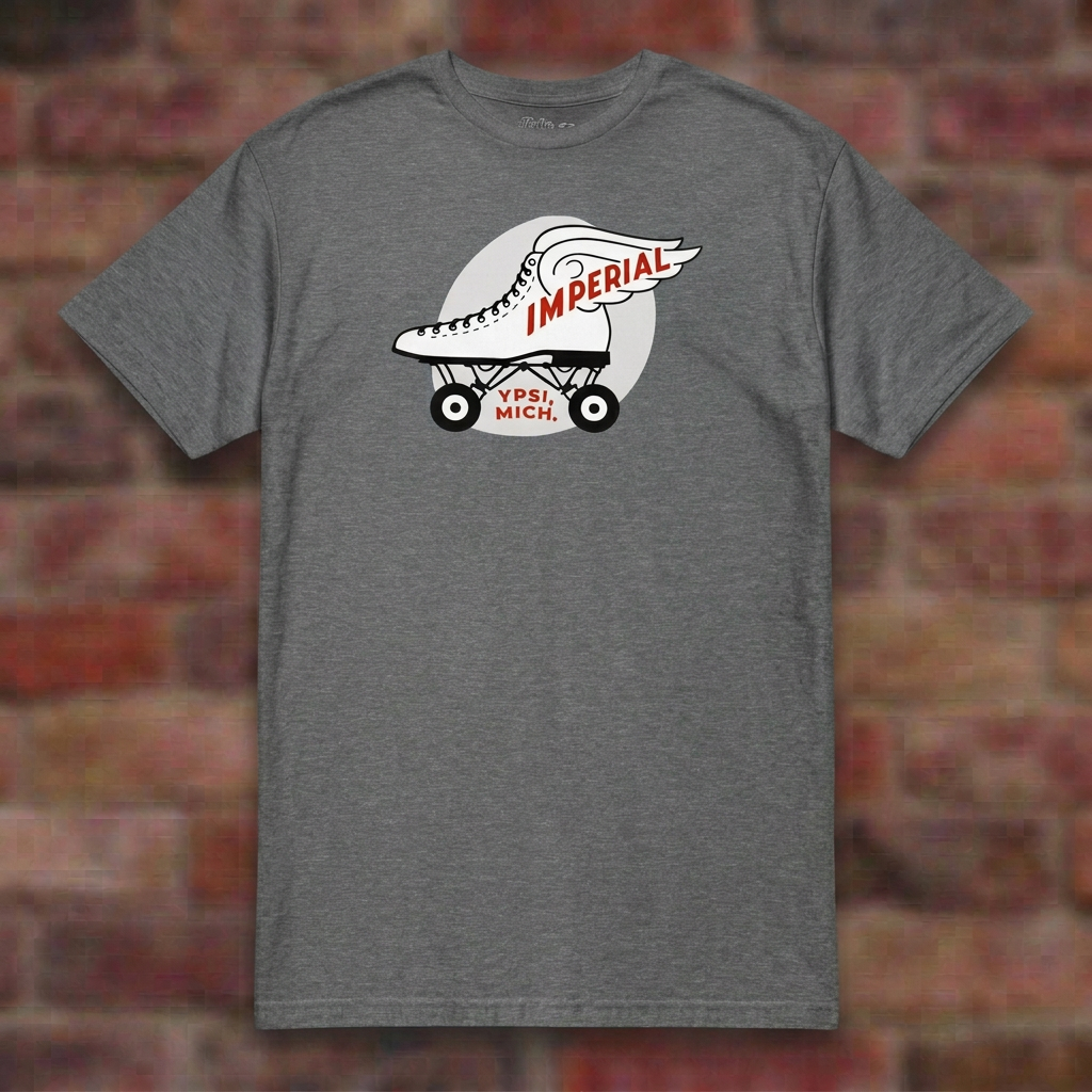 Imperial Roller Rink Graphite Heather T-shirt flat lay on brick background