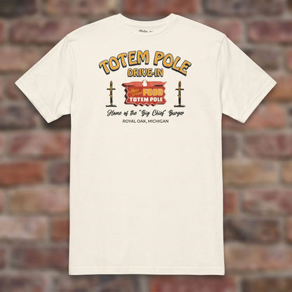 Totem Pole Drive-In Natural T-shirt flat lay on brick background