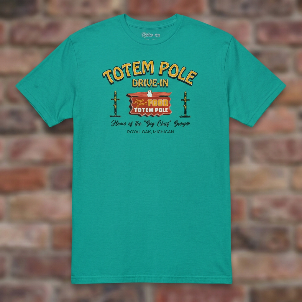 Totem Pole Drive-In Jade Dome T-shirt flat lay on brick background