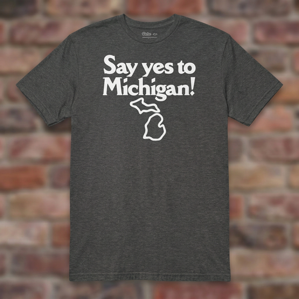 Say yes to Michigan Graphite Heather T-shirt flat lay on brick background