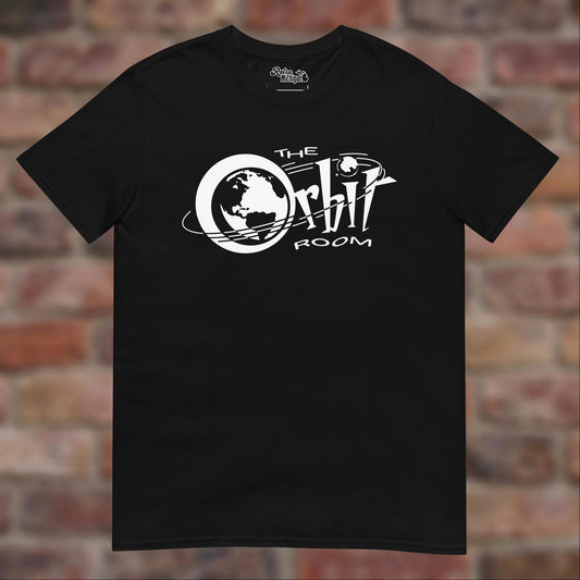 The Orbit Room Black T-shirt flat lay on weathered brick background
