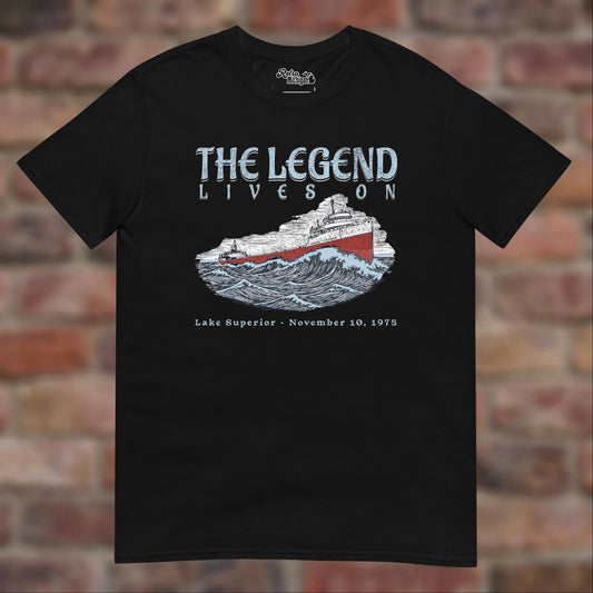 Black Edmund Fitzgerald T-shirt flat lay on brick background, November 10, 1975