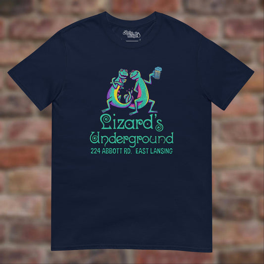 Lizard's Underground East Lansing Navy T-shirt flat lay on brick background